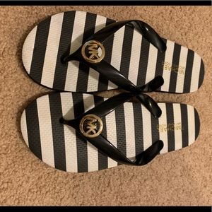 Black and White striped Micheal Kors Flip flips
